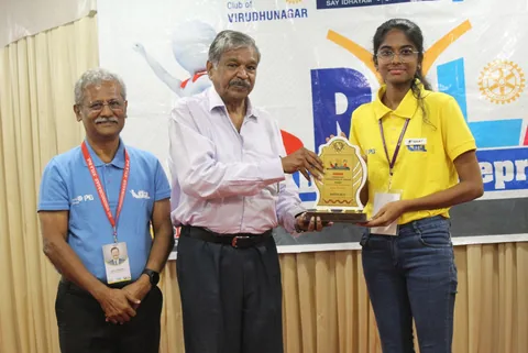 A QSAT student receiving an award at an innovation summit