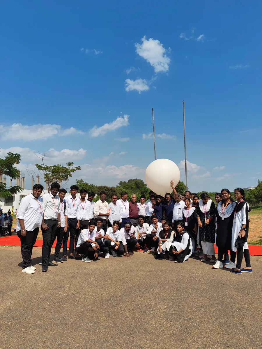 Students gathered around a high-altitude balloon launch at a QSAT field session